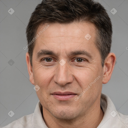 Joyful white adult male with short  brown hair and brown eyes