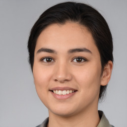 Joyful white young-adult female with medium  brown hair and brown eyes