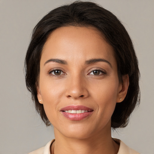 Joyful white young-adult female with medium  brown hair and brown eyes