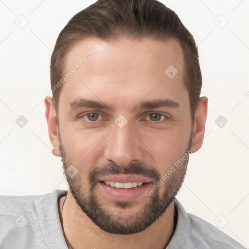 Joyful white young-adult male with short  brown hair and brown eyes