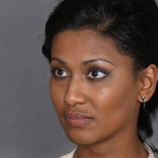 Neutral black young-adult female with short  black hair and brown eyes