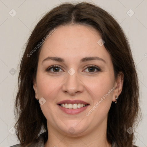 Joyful white adult female with medium  brown hair and brown eyes