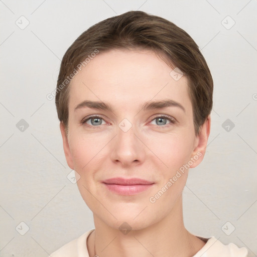 Joyful white young-adult female with short  brown hair and grey eyes