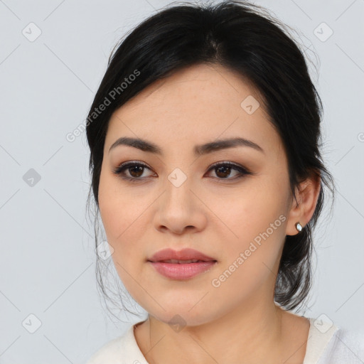 Joyful asian young-adult female with medium  black hair and brown eyes