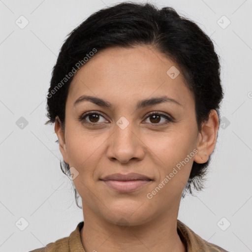 Joyful latino young-adult female with long  brown hair and brown eyes