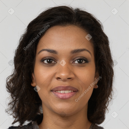 Joyful black young-adult female with long  brown hair and brown eyes