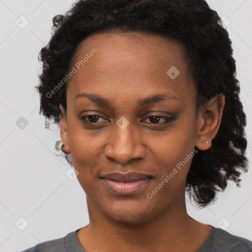 Joyful black adult female with short  black hair and brown eyes