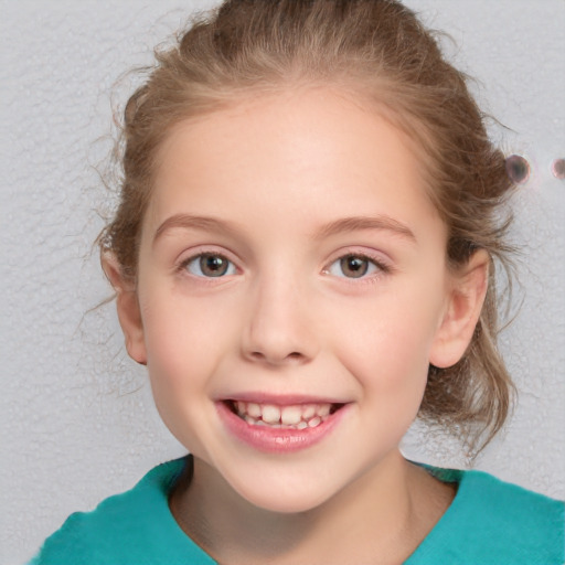 Joyful white child female with medium  brown hair and grey eyes