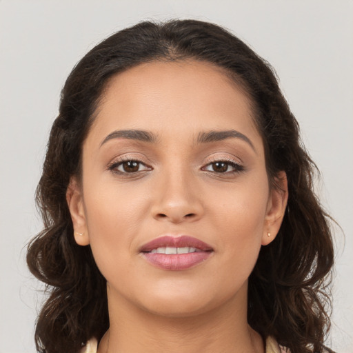 Joyful white young-adult female with long  brown hair and brown eyes