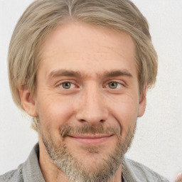 Joyful white adult male with short  brown hair and grey eyes