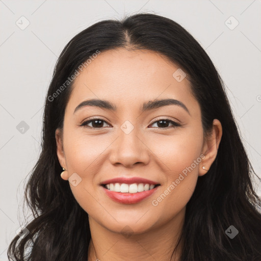 Joyful latino young-adult female with long  brown hair and brown eyes