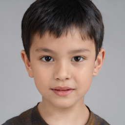 Joyful white child male with short  brown hair and brown eyes