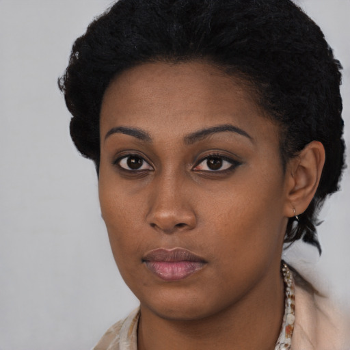 Neutral black young-adult female with short  brown hair and brown eyes