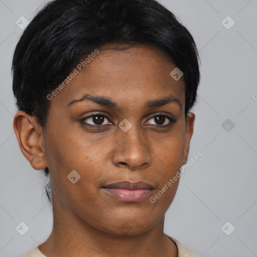 Joyful black young-adult female with short  black hair and brown eyes