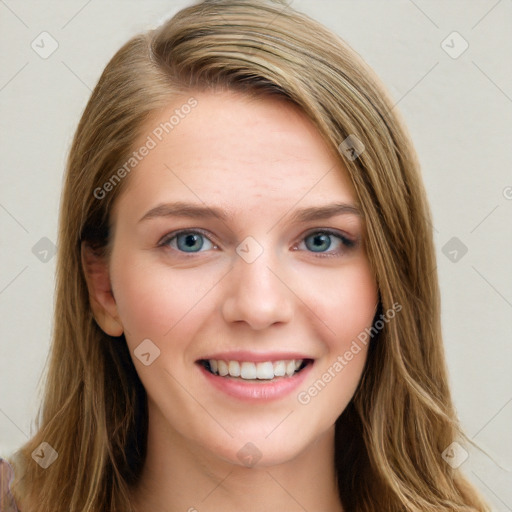 Joyful white young-adult female with long  brown hair and blue eyes