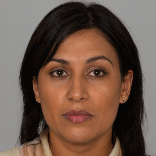 Neutral asian adult female with long  brown hair and brown eyes