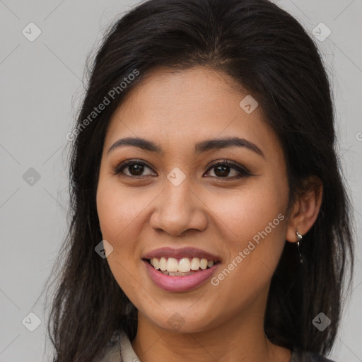 Joyful white young-adult female with long  brown hair and brown eyes