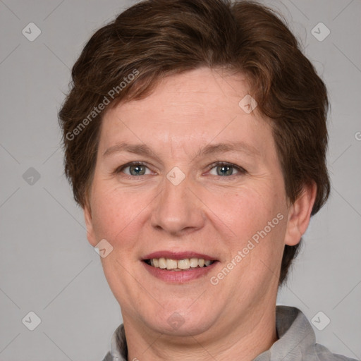 Joyful white adult female with medium  brown hair and blue eyes