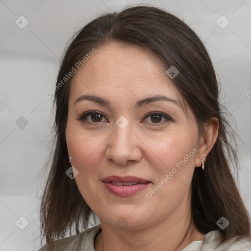 Joyful white adult female with medium  brown hair and brown eyes