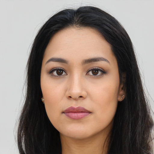 Neutral latino young-adult female with long  black hair and brown eyes