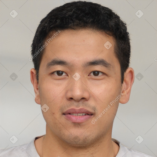 Joyful latino young-adult male with short  black hair and brown eyes