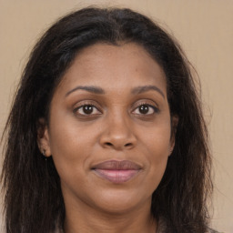 Joyful asian young-adult female with long  brown hair and brown eyes