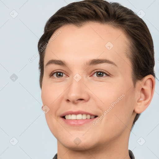 Joyful white young-adult female with short  brown hair and brown eyes