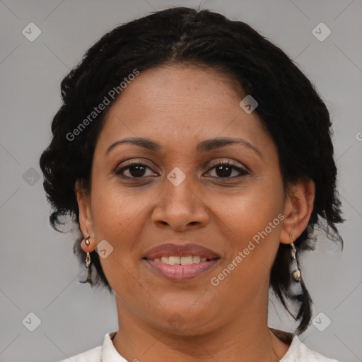 Joyful latino adult female with medium  brown hair and brown eyes