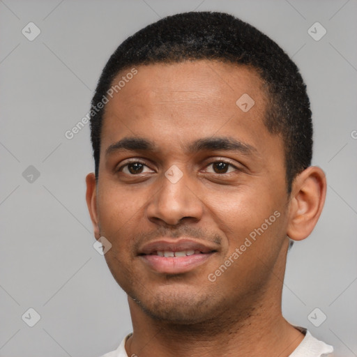 Joyful black young-adult male with short  black hair and brown eyes