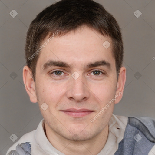 Joyful white adult male with short  brown hair and brown eyes