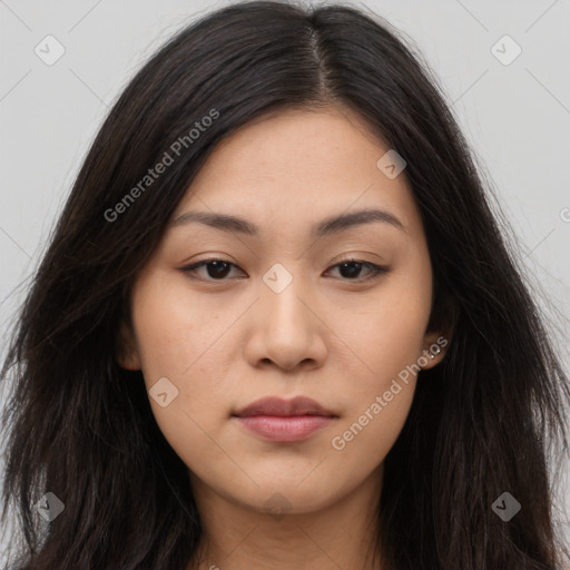 Joyful asian young-adult female with long  brown hair and brown eyes