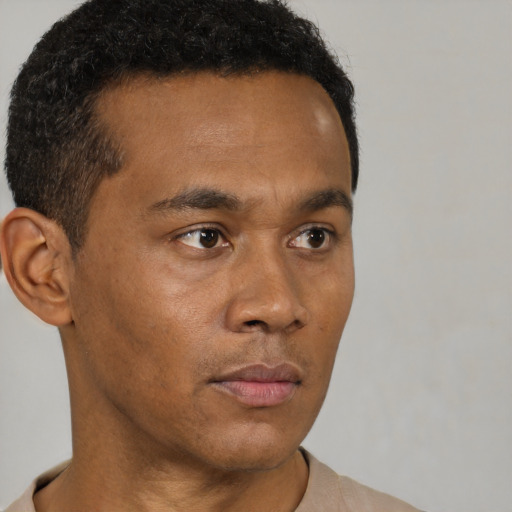 Neutral black young-adult male with short  brown hair and brown eyes
