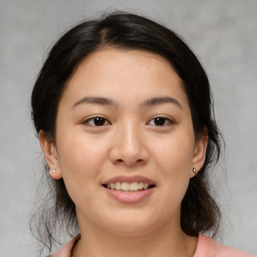 Joyful asian young-adult female with medium  brown hair and brown eyes