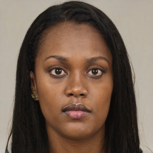 Neutral black young-adult female with long  brown hair and brown eyes