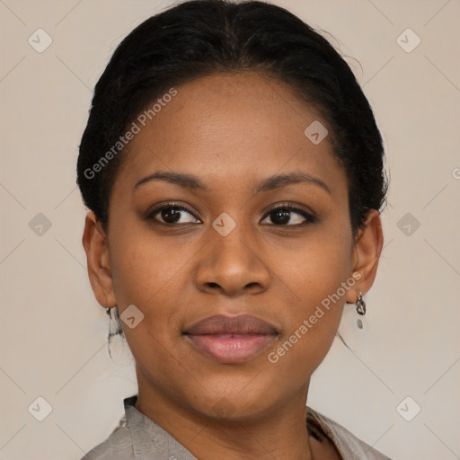 Joyful black young-adult female with short  black hair and brown eyes