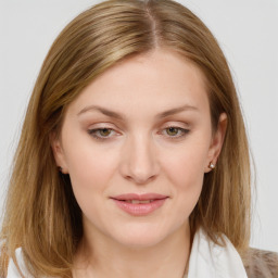 Joyful white young-adult female with long  brown hair and blue eyes