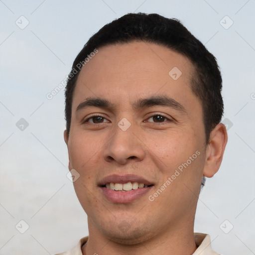 Joyful white young-adult male with short  black hair and brown eyes