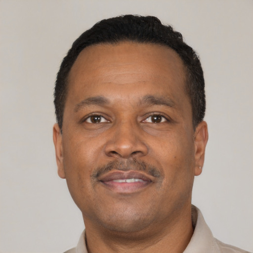 Neutral black adult male with short  black hair and brown eyes