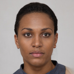 Neutral black young-adult female with short  black hair and brown eyes