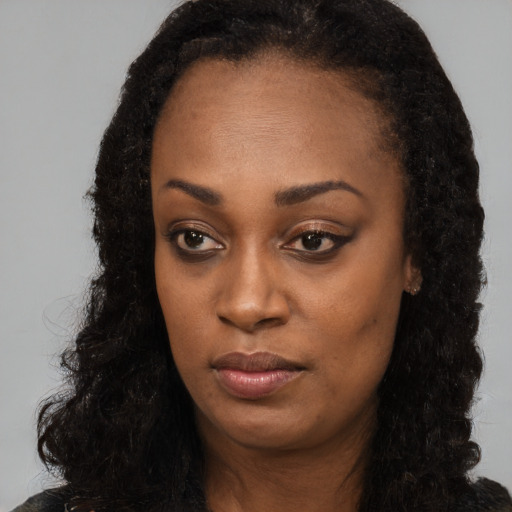 Neutral black young-adult female with long  black hair and brown eyes