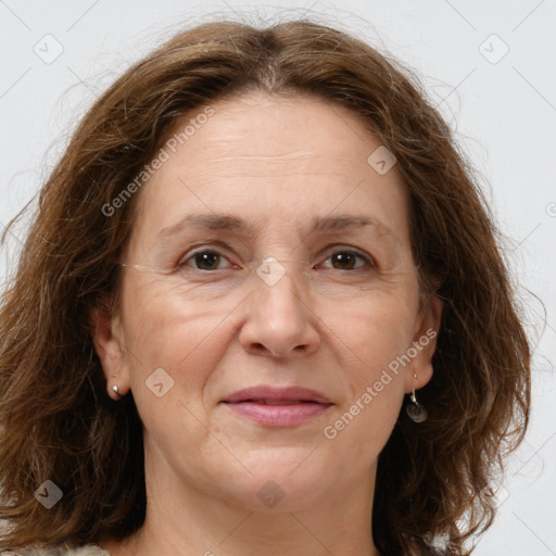 Joyful white adult female with long  brown hair and brown eyes