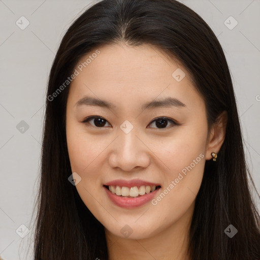 Joyful asian young-adult female with long  brown hair and brown eyes