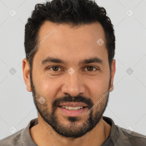 Joyful white young-adult male with short  black hair and brown eyes