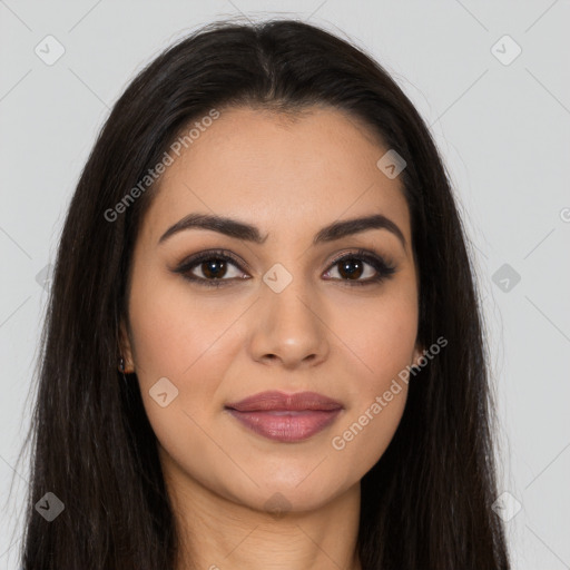 Joyful latino young-adult female with long  brown hair and brown eyes