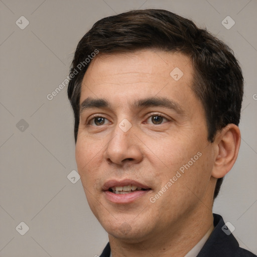 Joyful white young-adult male with short  black hair and brown eyes