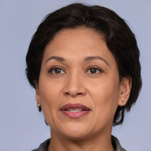 Joyful white adult female with medium  brown hair and brown eyes