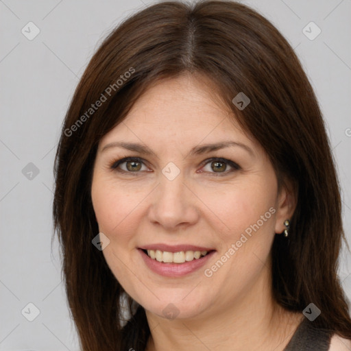 Joyful white adult female with medium  brown hair and brown eyes