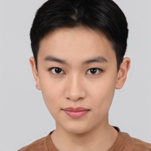 Joyful asian young-adult female with short  black hair and brown eyes