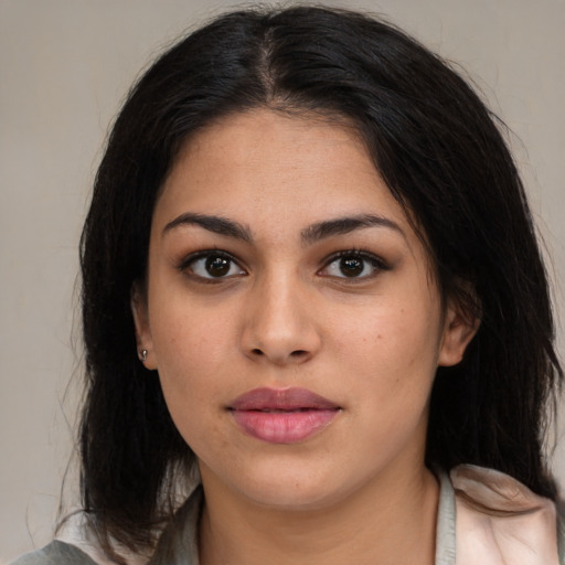 Neutral latino young-adult female with medium  brown hair and brown eyes