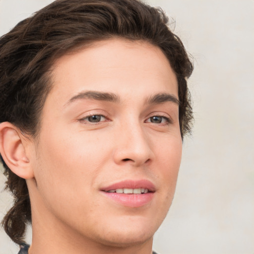 Joyful white young-adult male with medium  brown hair and brown eyes